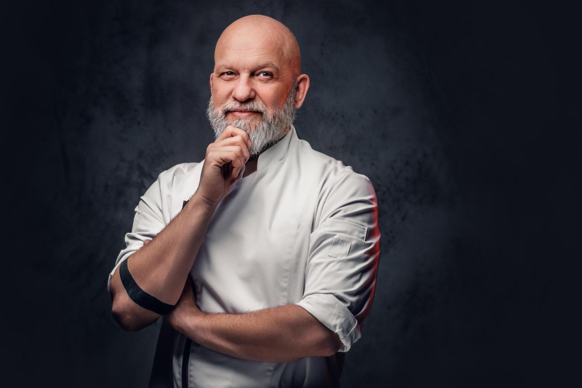portrait of head chef with folded arms